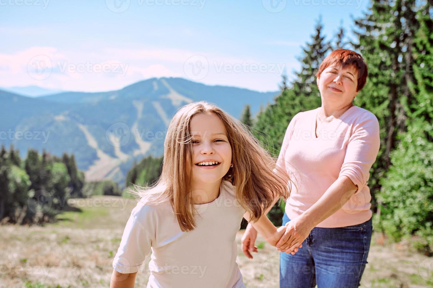 family grandmother and mother in mountains happy to travel. Leisure family time, summer concept photo