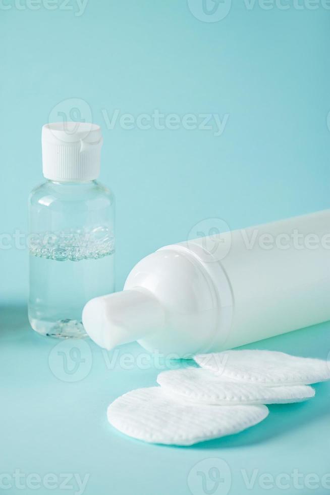 Spa accessories and cosmetics for skin care on blue background. photo