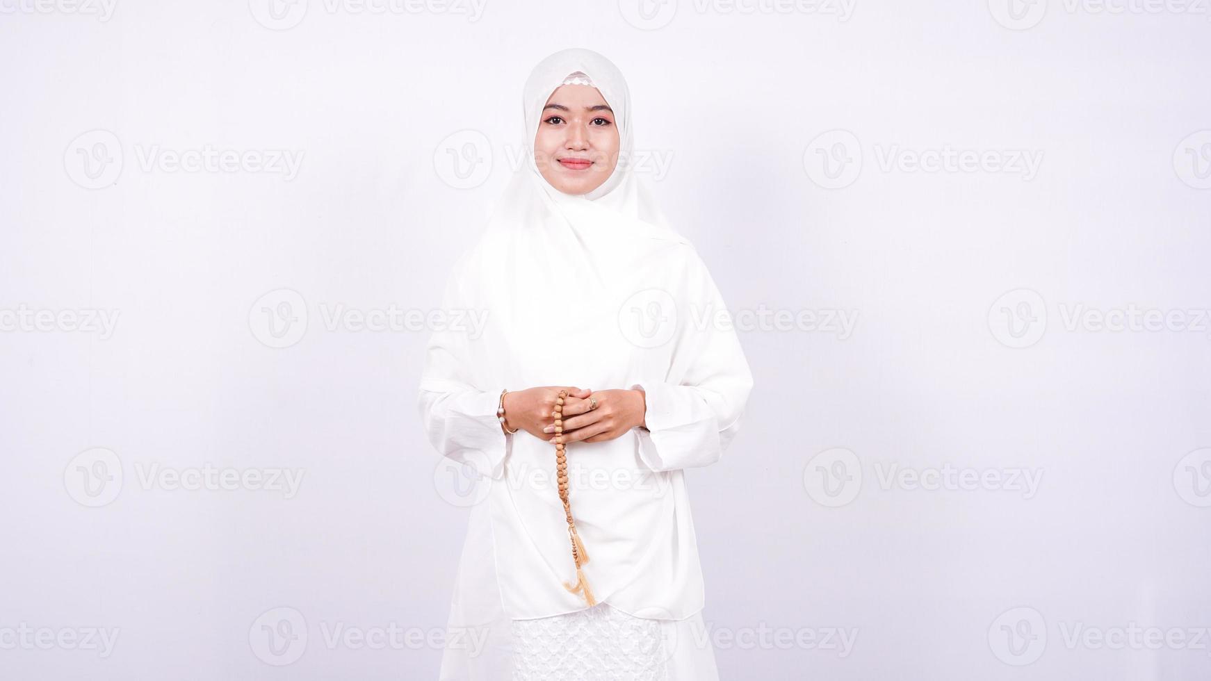 Asian women muslim pray on a white background photo
