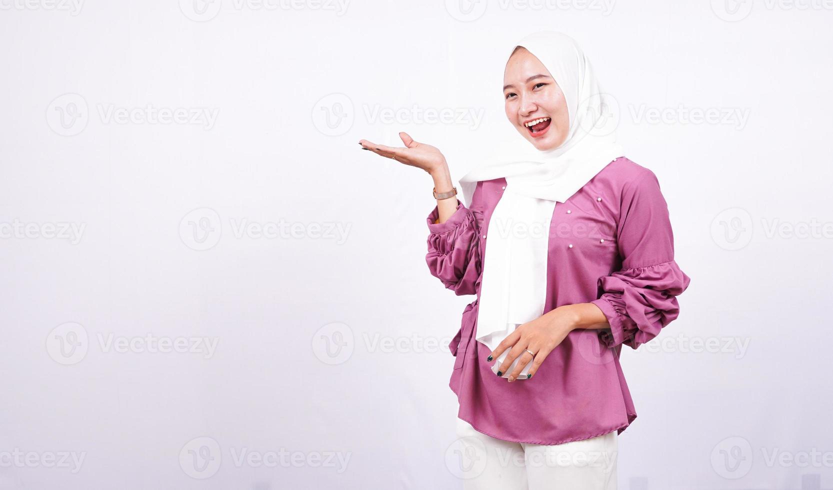 beautiful women hijab pointing blank area on left isolated white background photo