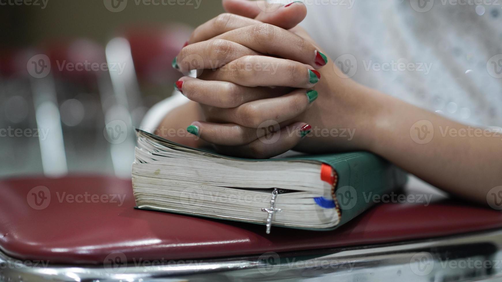 Christian women pray and hold the Scriptures photo