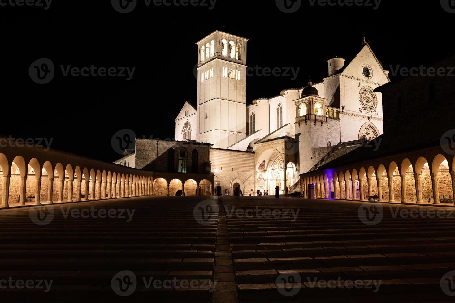 Assisi Basilica by night,  Umbria region, Italy. The town is famous for the most important Italian Basilica dedicated to St. Francis - San Francesco. photo