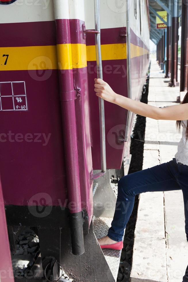 Woman enters train photo