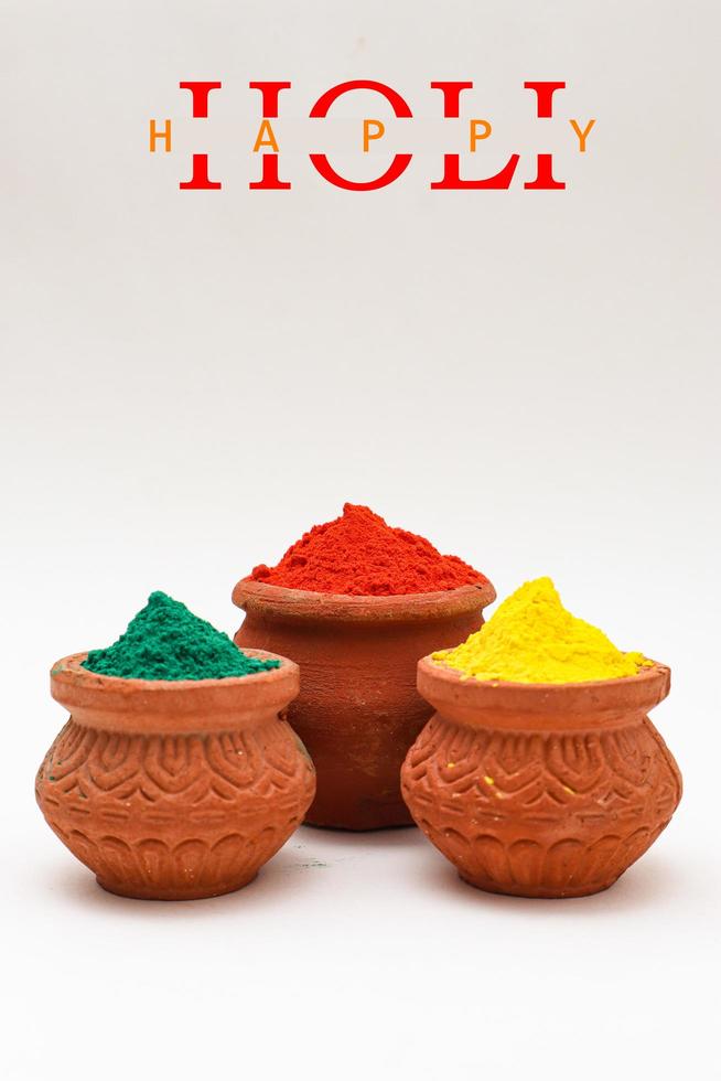 Indian festival Holi concept Multi color's bowl with colorful background. photo