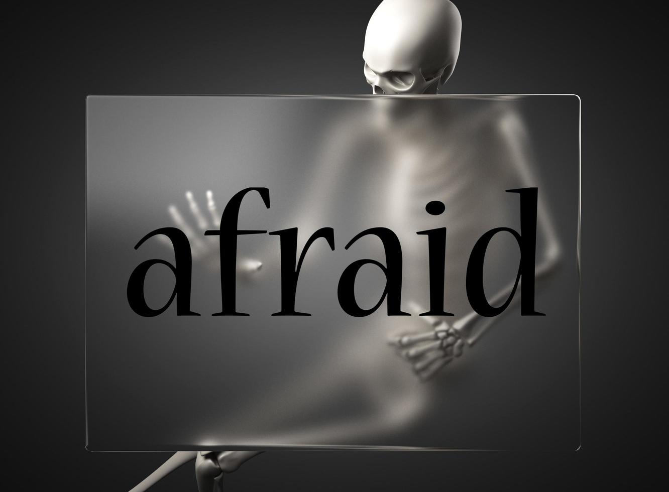 afraid word on glass and skeleton photo
