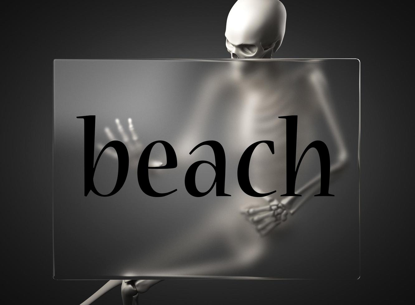 beach word on glass and skeleton photo