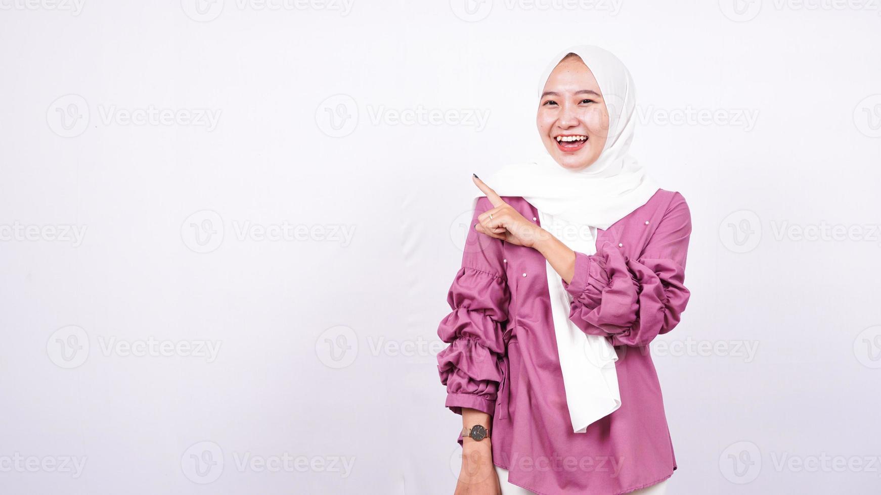 beautiful women hijab pointing blank area on left isolated white background photo