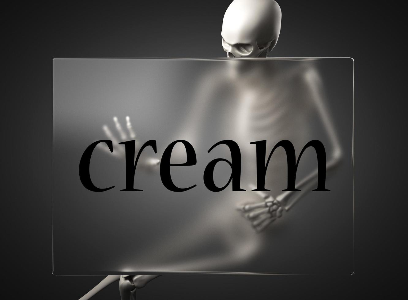 cream word on glass and skeleton photo