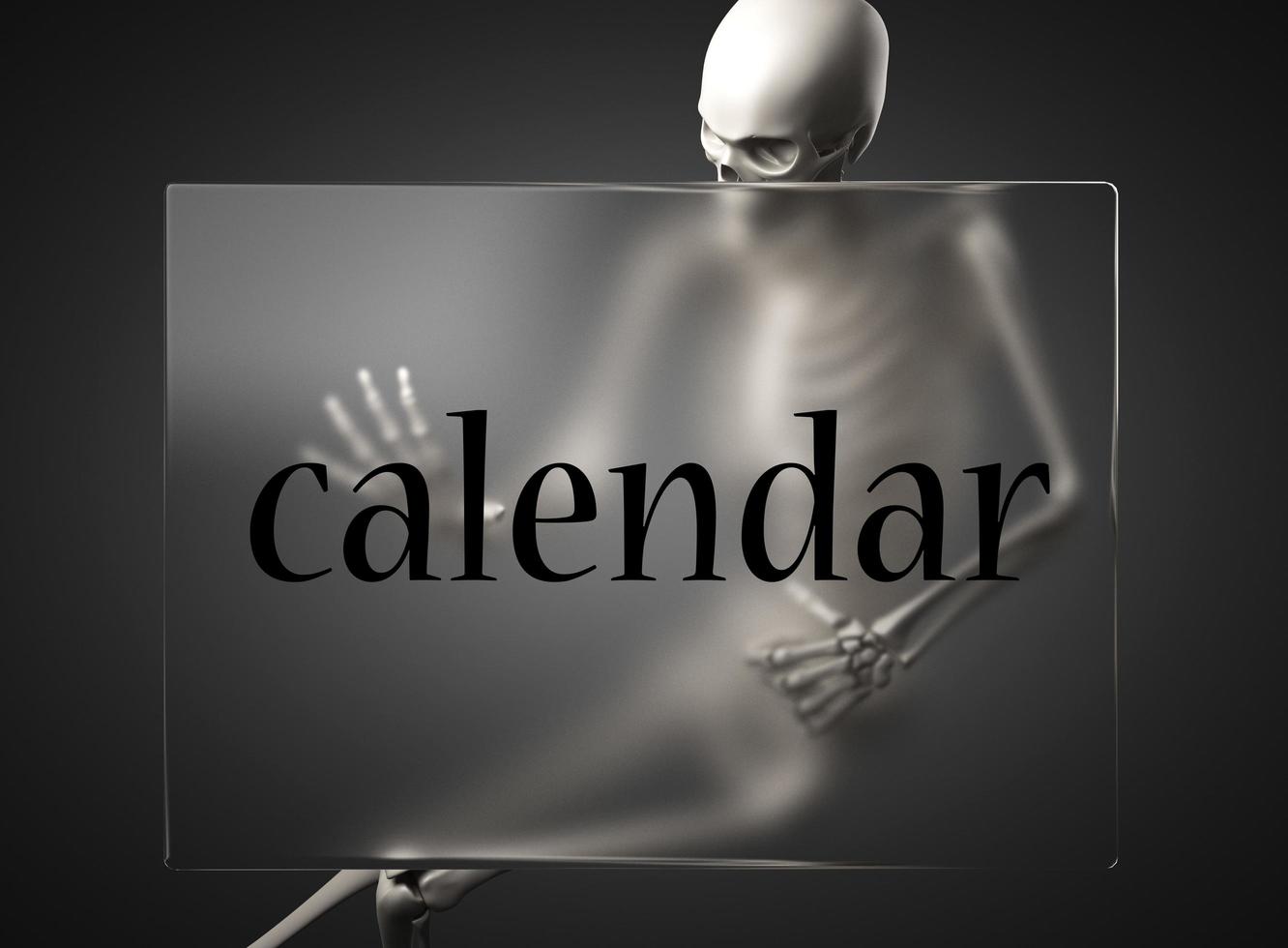 palabra de calendario en vidrio y esqueleto foto