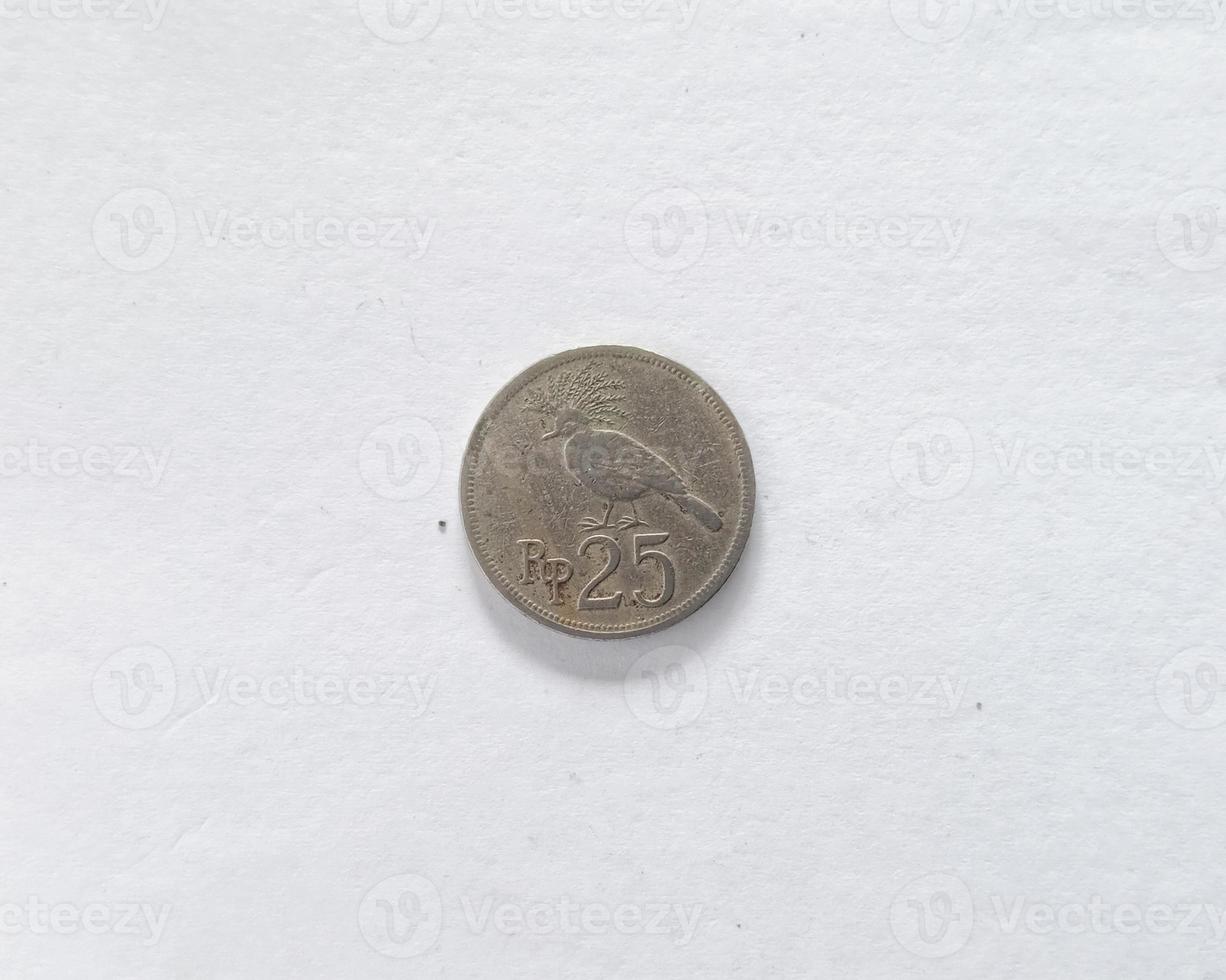 25 Rupiah.  Indonesian old money scattered in the 70s.  Suitable for content related to finance and investment. photo