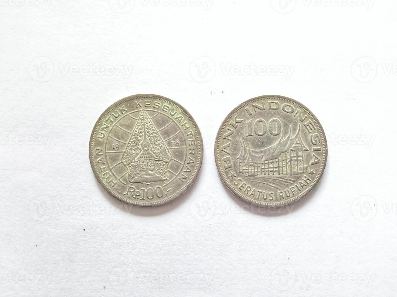 100 Rupiah.  Indonesian old money scattered in the 70s.  Suitable for content related to finance and investment. photo