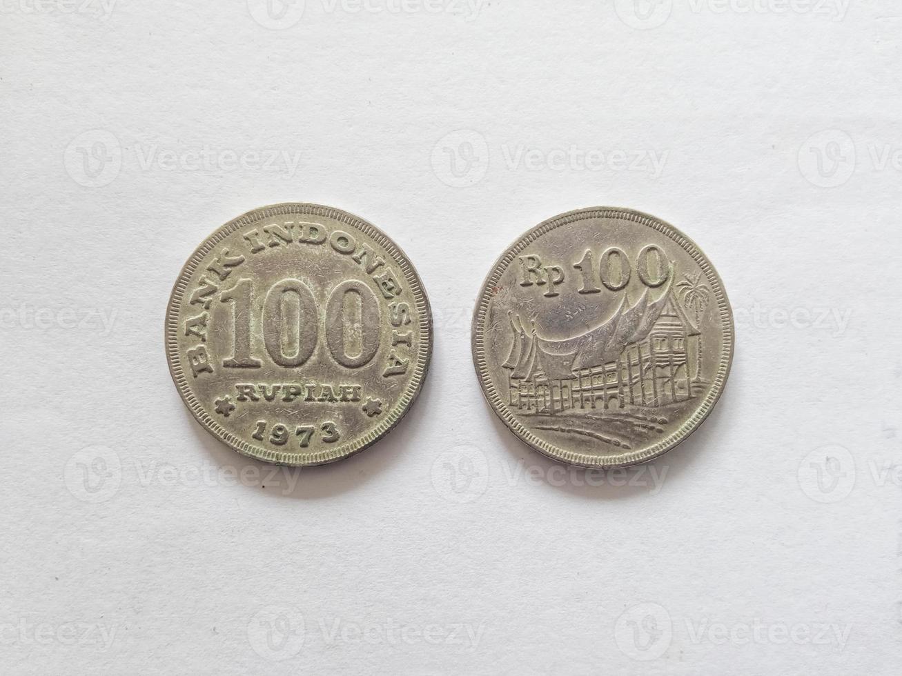 100 Rupiah.  Indonesian old money scattered in the 70s.  Suitable for content related to finance and investment. photo