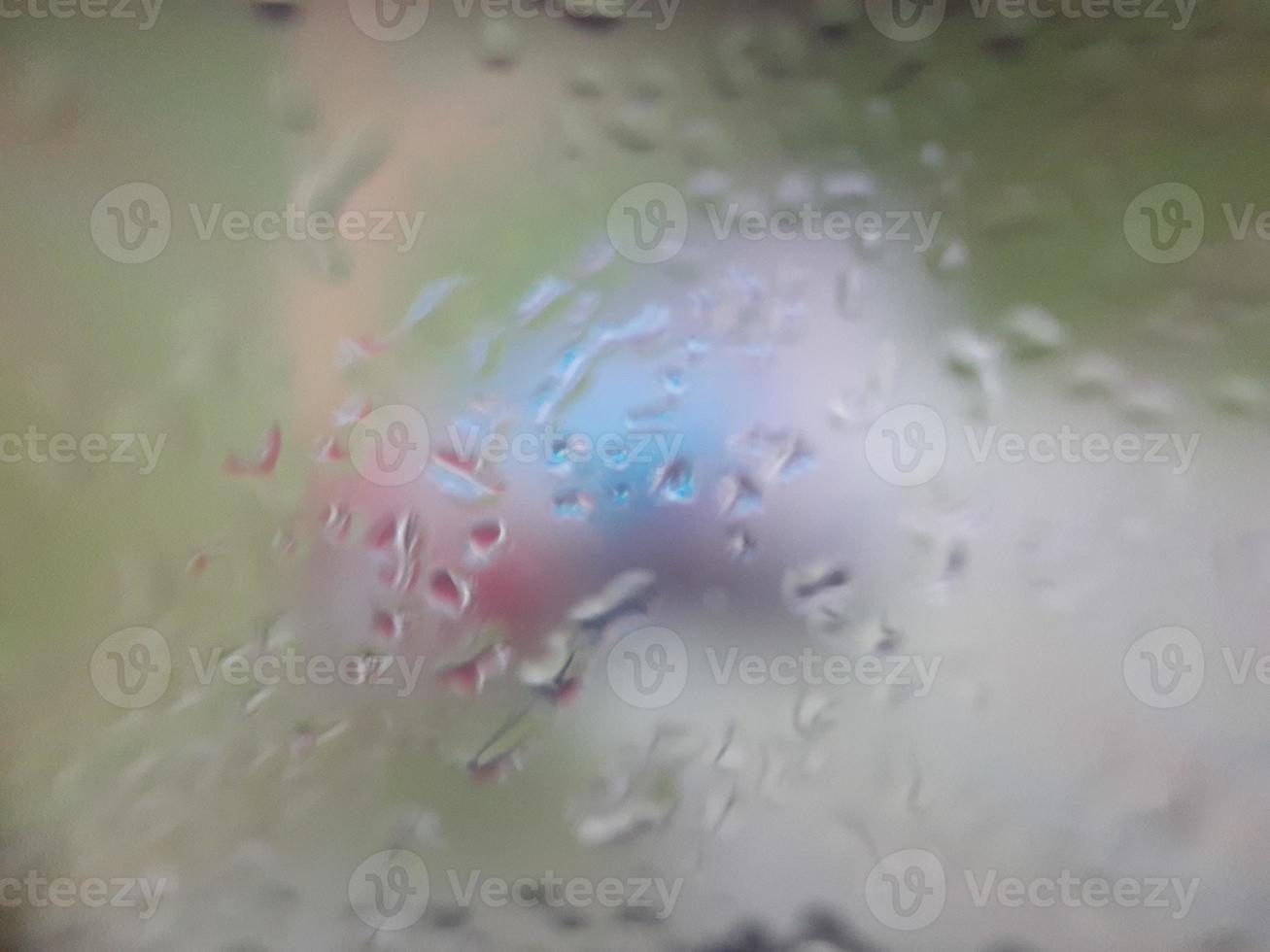 Water drops on window with blur background photo