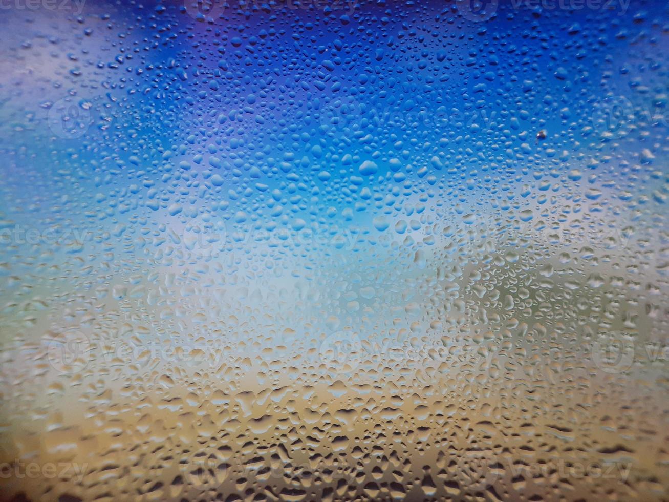 Water drops on window with blur background photo