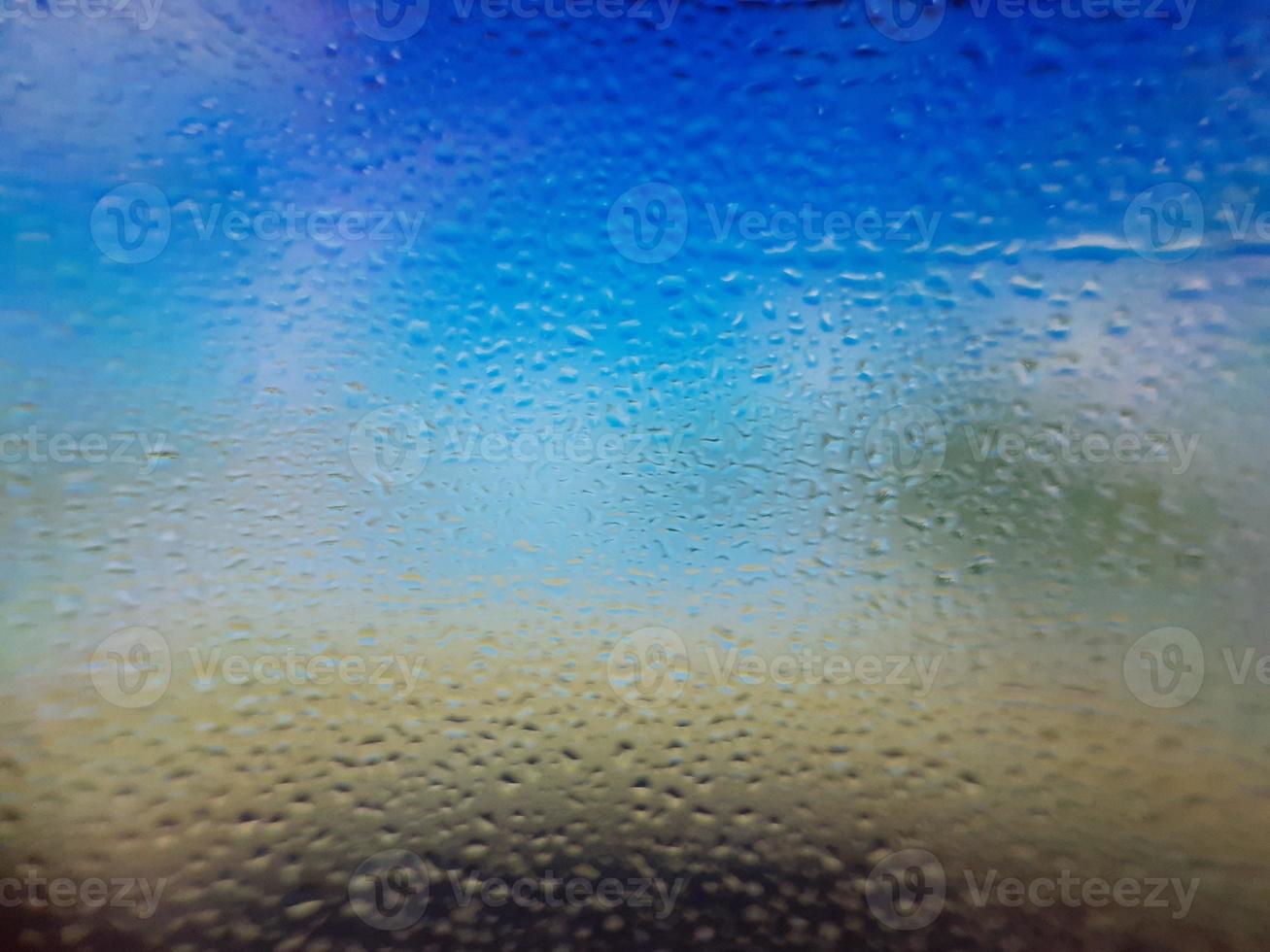 Water drops on window with blur background photo