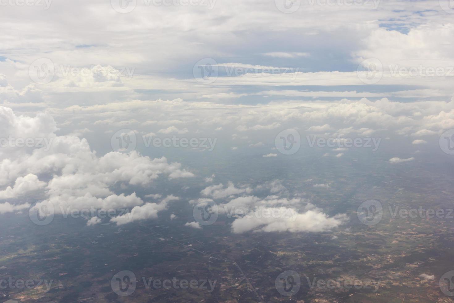 Blue sky with clouds on the airplane photo