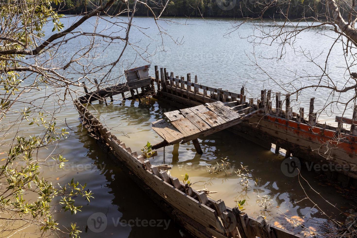Beautiful natural view of Khao Khanab Nam mountain and sunken fisher ship at Krabi River, Krabi, Thailand. photo