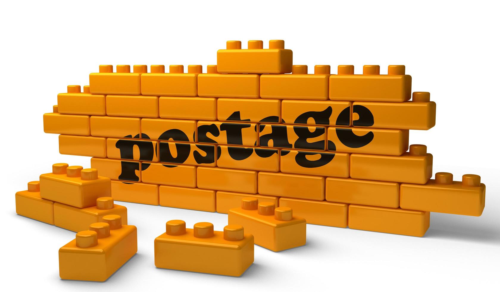 postage word on yellow brick wall photo