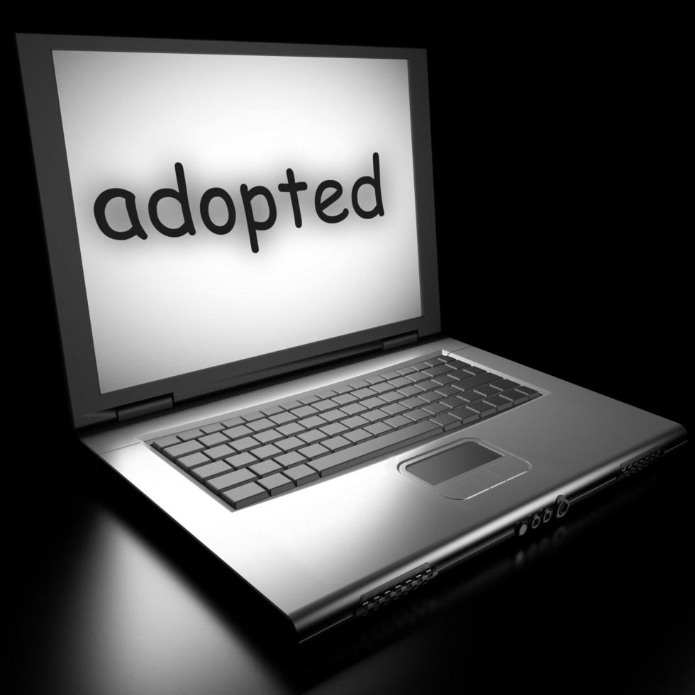 adopted word on laptop photo