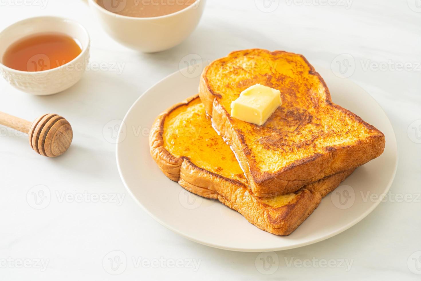 French toasted with butter and honey photo