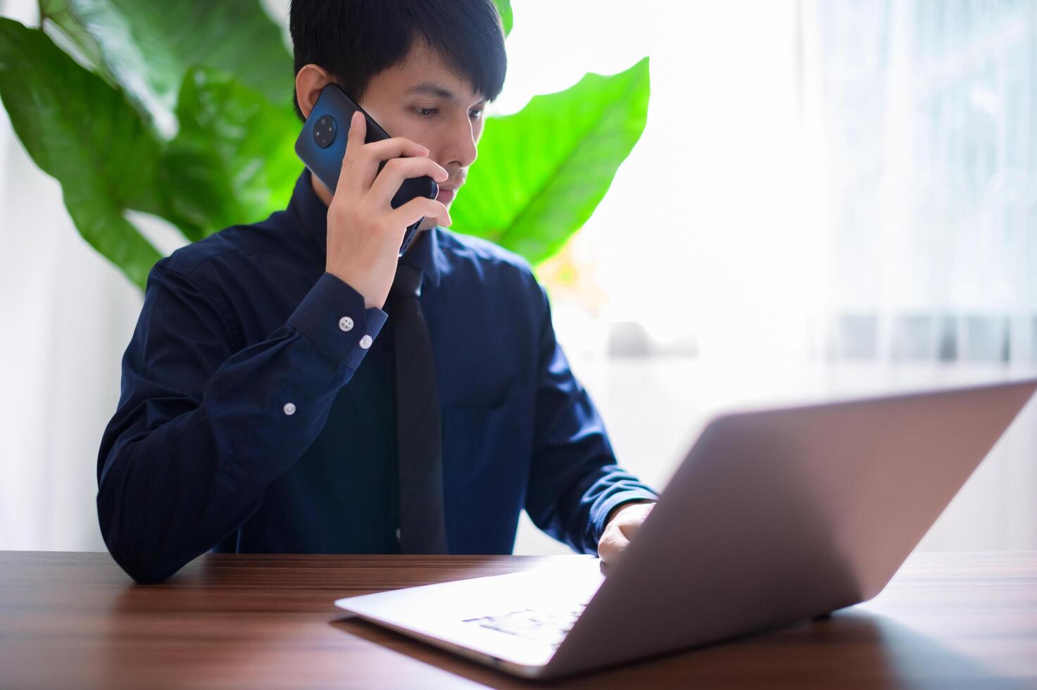 Businessmen are calling and talking through smartphones. photo