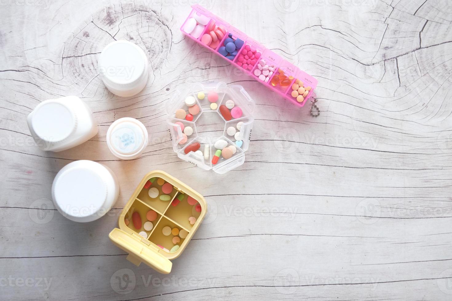 top view of many medical pill box on table photo