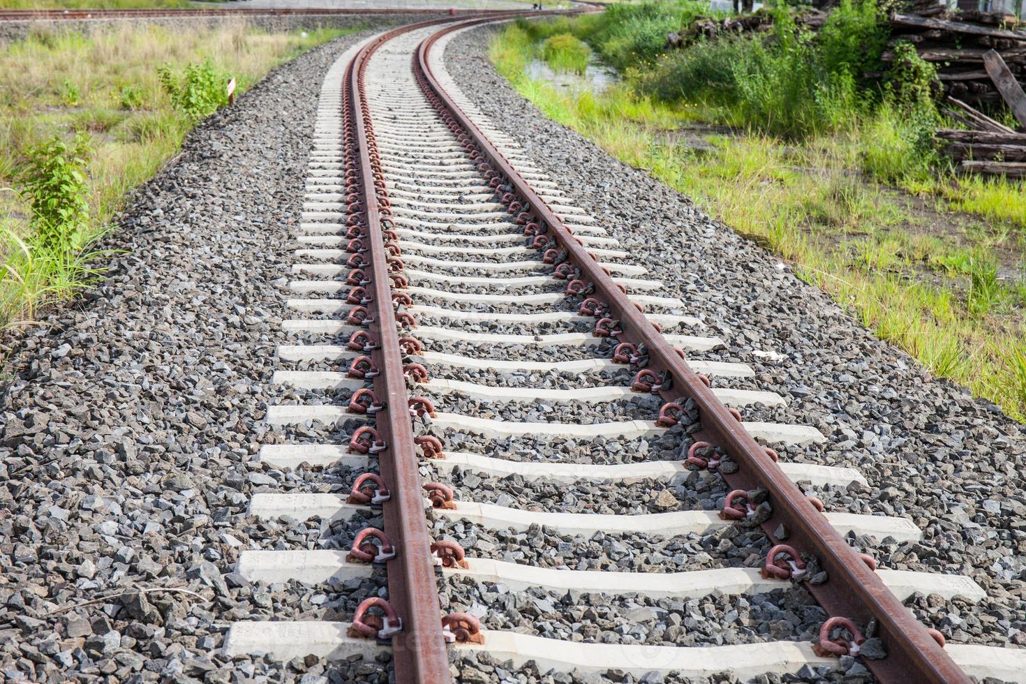 railroad tracks with rust on rock background photo