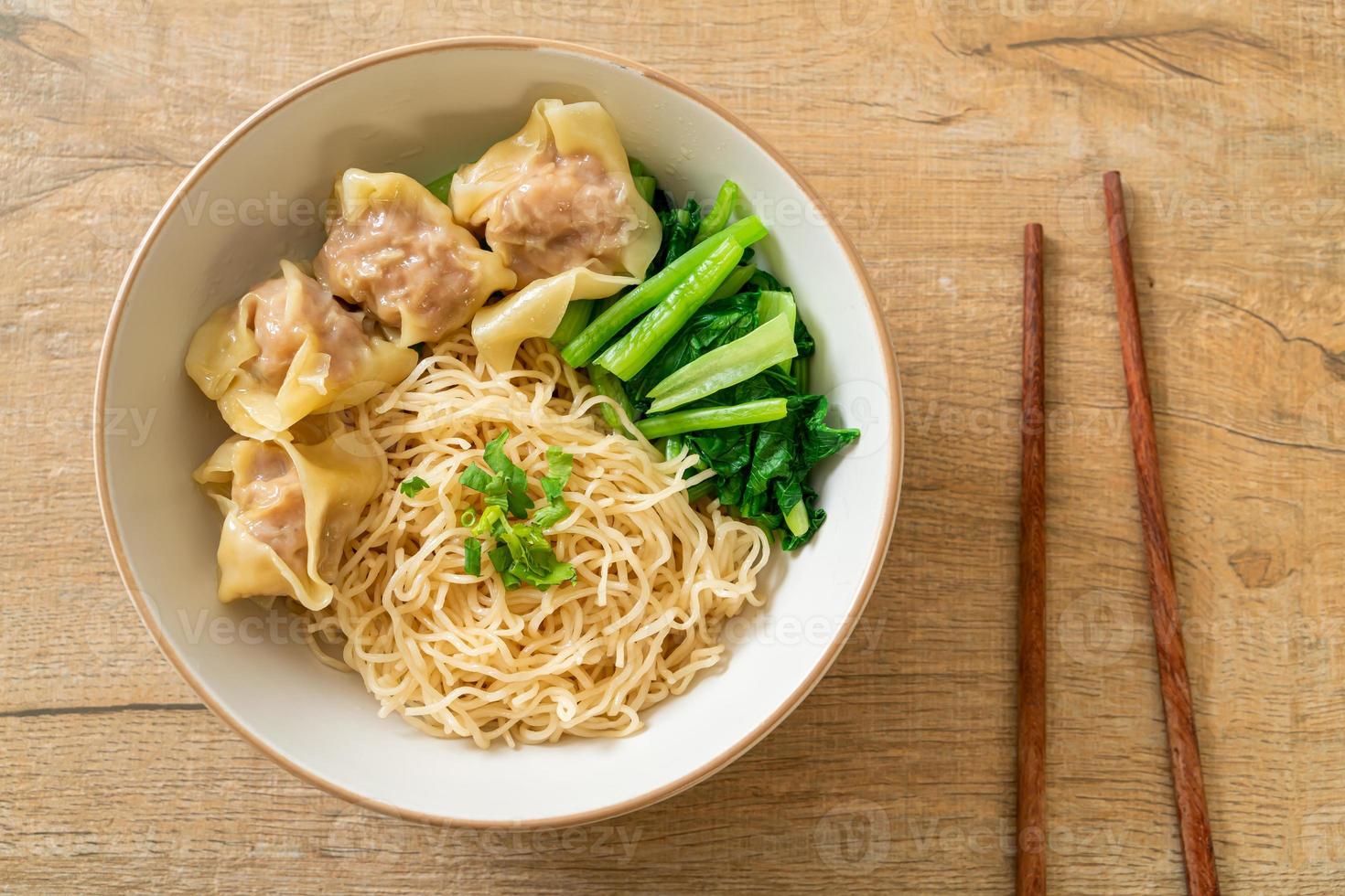 dried egg noodles with pork wonton or pork dumplings without soup photo