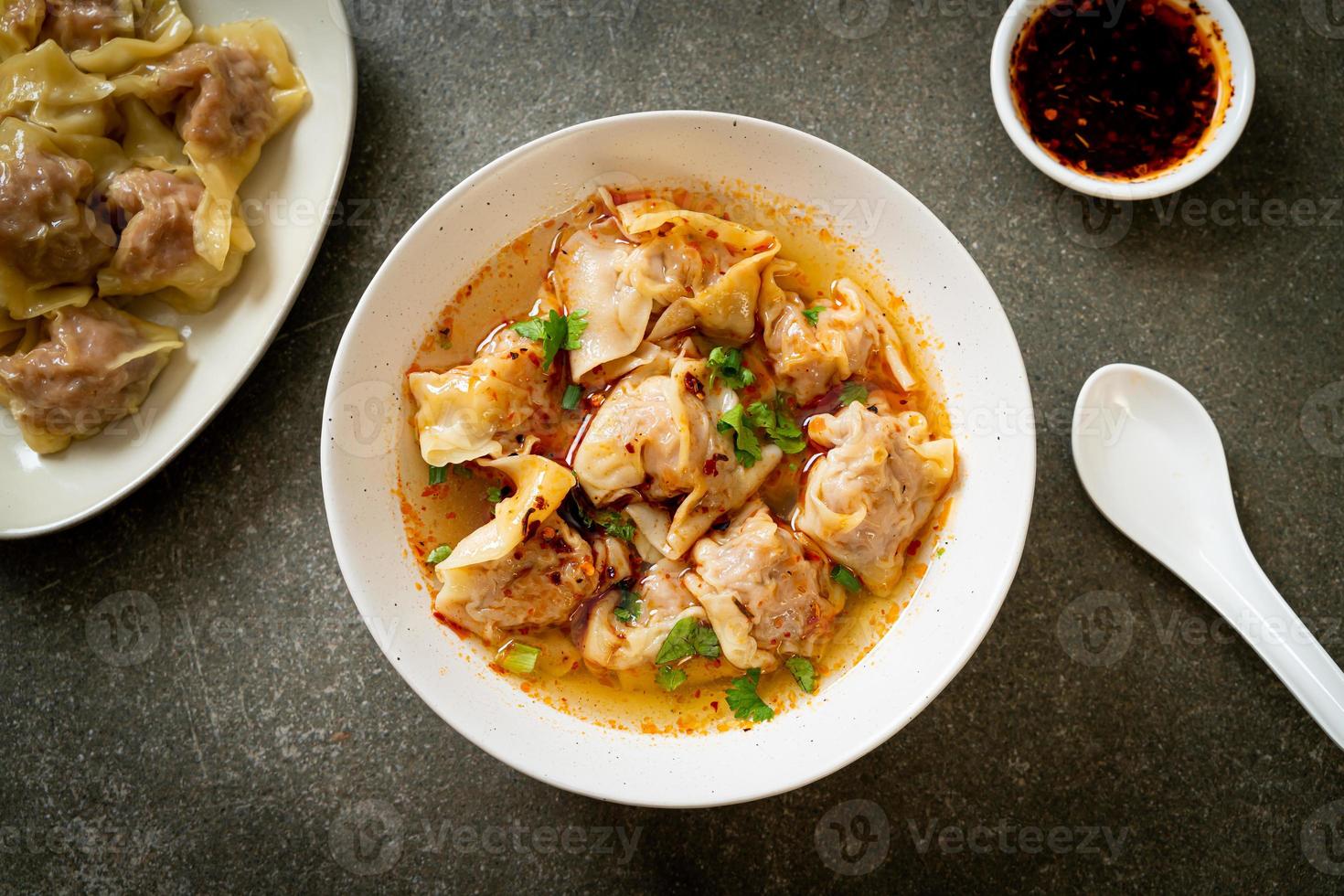 pork wonton soup or pork dumplings soup with roasted chili photo