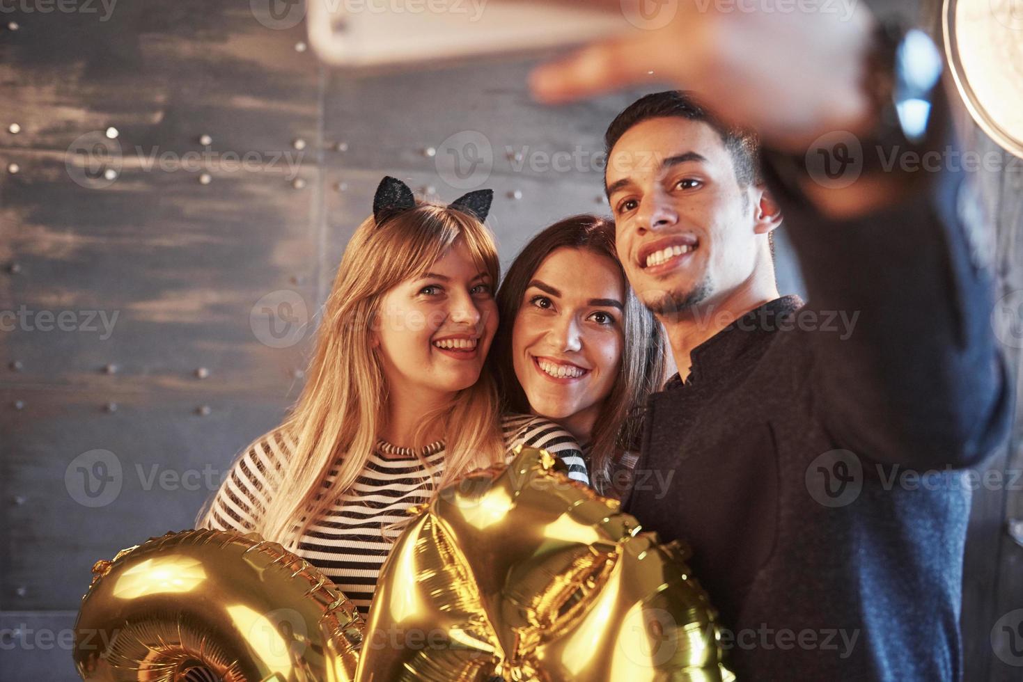 Picture showing group of multiethnic friends celebrating New Year photo