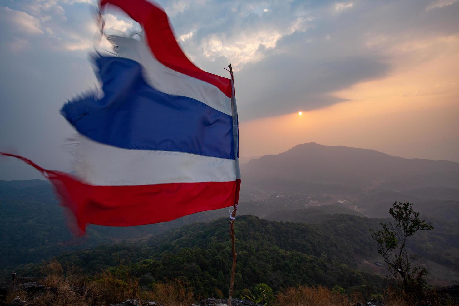 Thai flag on the viewpoint of Pha Khao Noi, Chiang Mai, Thailand photo