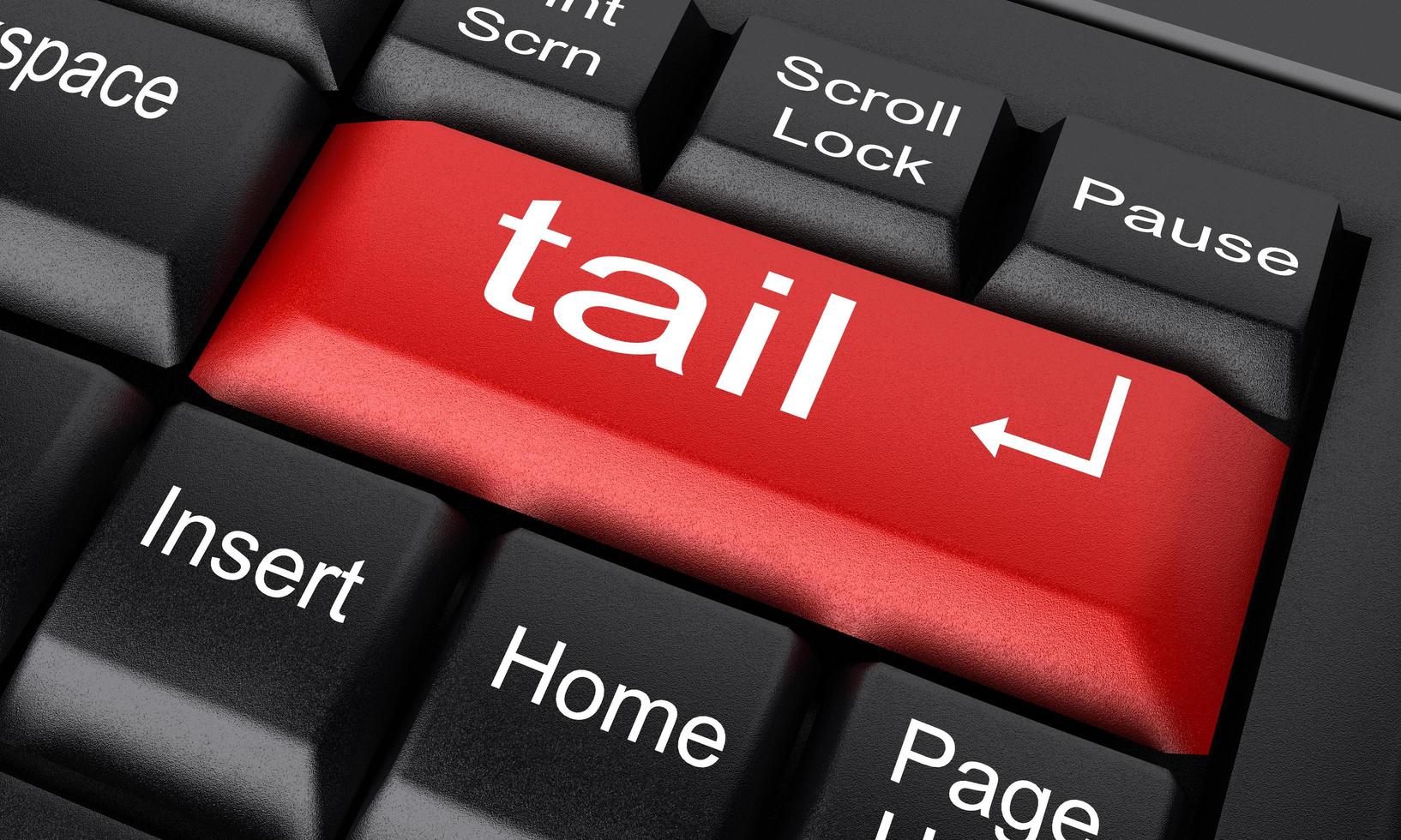 tail word on red keyboard button photo