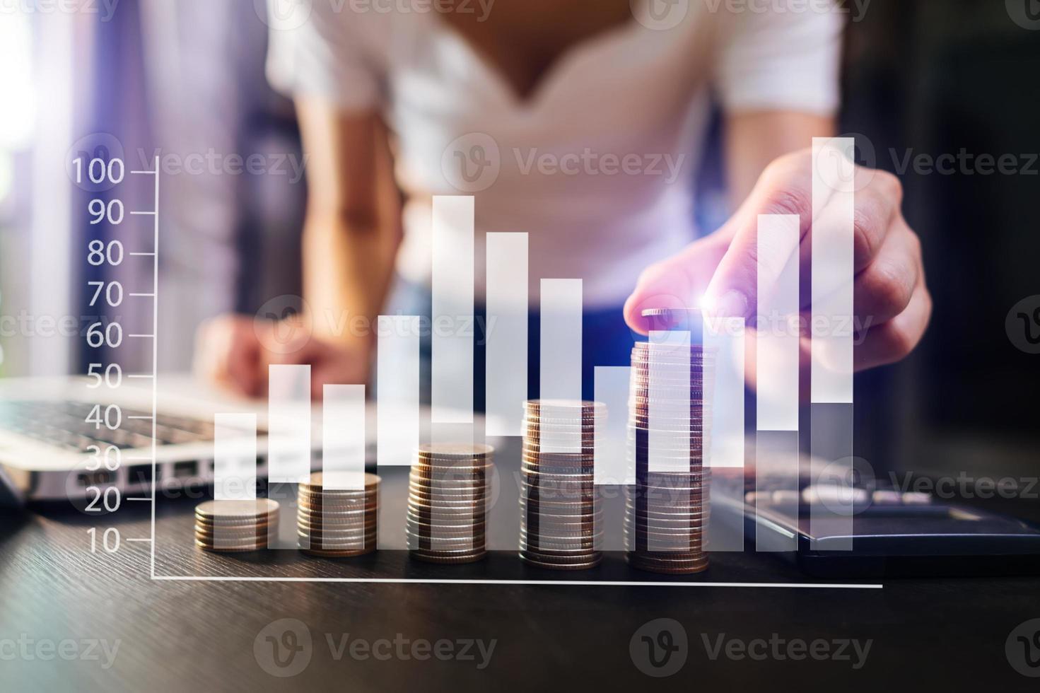 business documents on office desk with laptop and smart phone and graph business diagram and man working in morning light photo