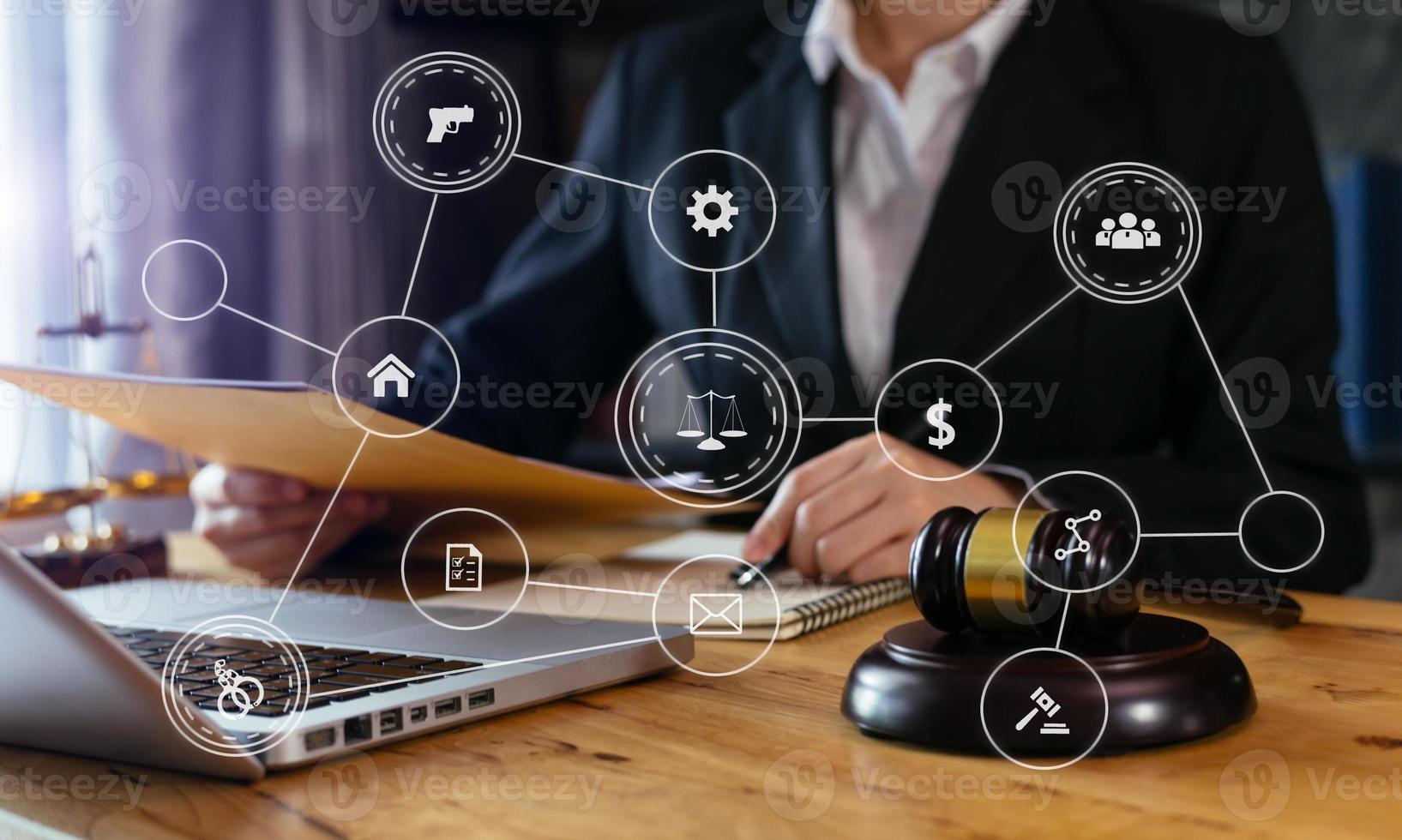 justice and law concept.Male judge in a courtroom  the gavel, working with smart phone and laptop and digital tablet computer on wood table with VR icon photo