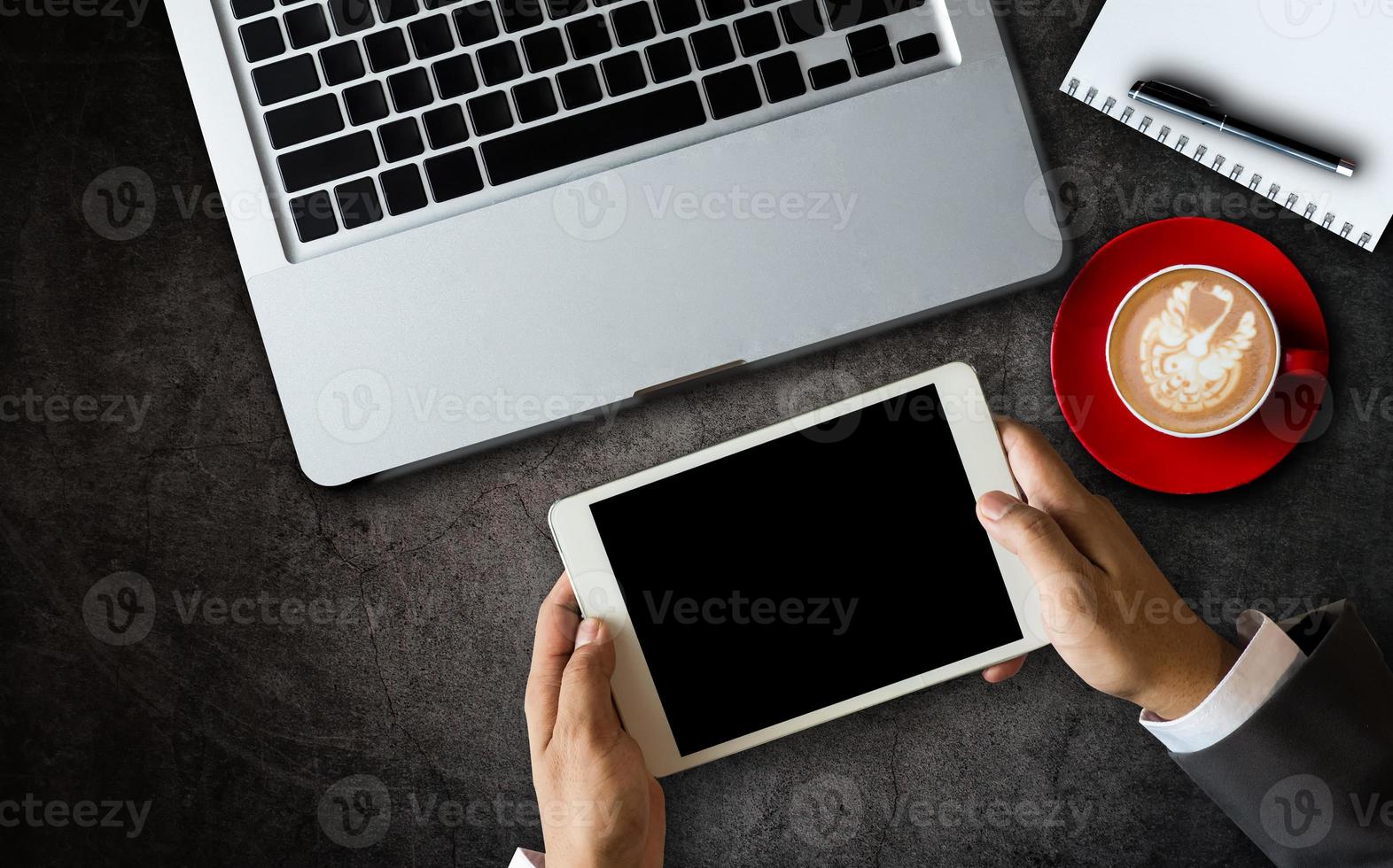 Top view.Business analysis and strategy concept. Businessman analyzing financial data on smartphone and laptop photo