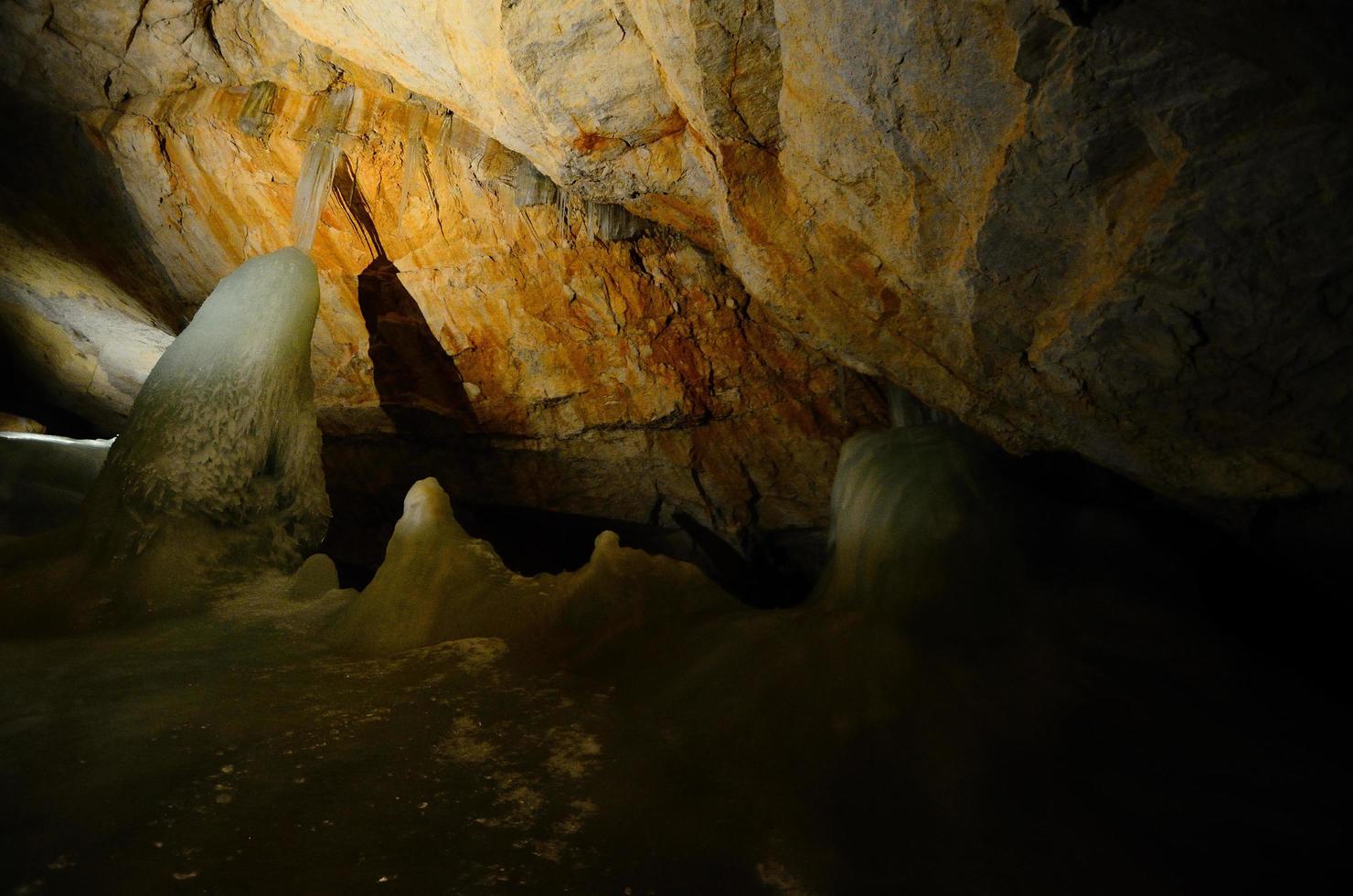 ice and rocks in a cave photo