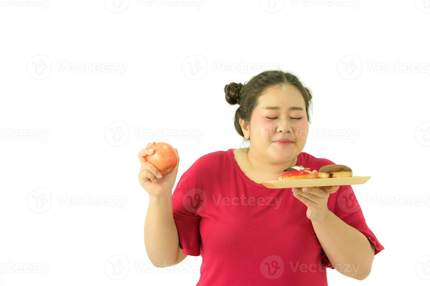 las mujeres obesas asiáticas tienen sobrepeso. con varias emociones para ella, comer y hacer ejercicio foto