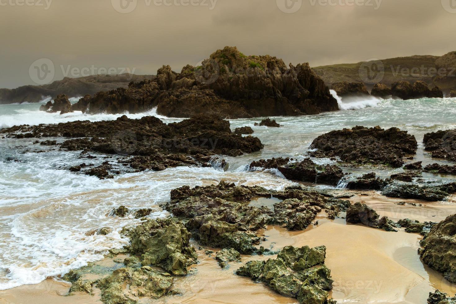 Sea rocks of a beach in Cantabria, Spain. Horizontal image. photo