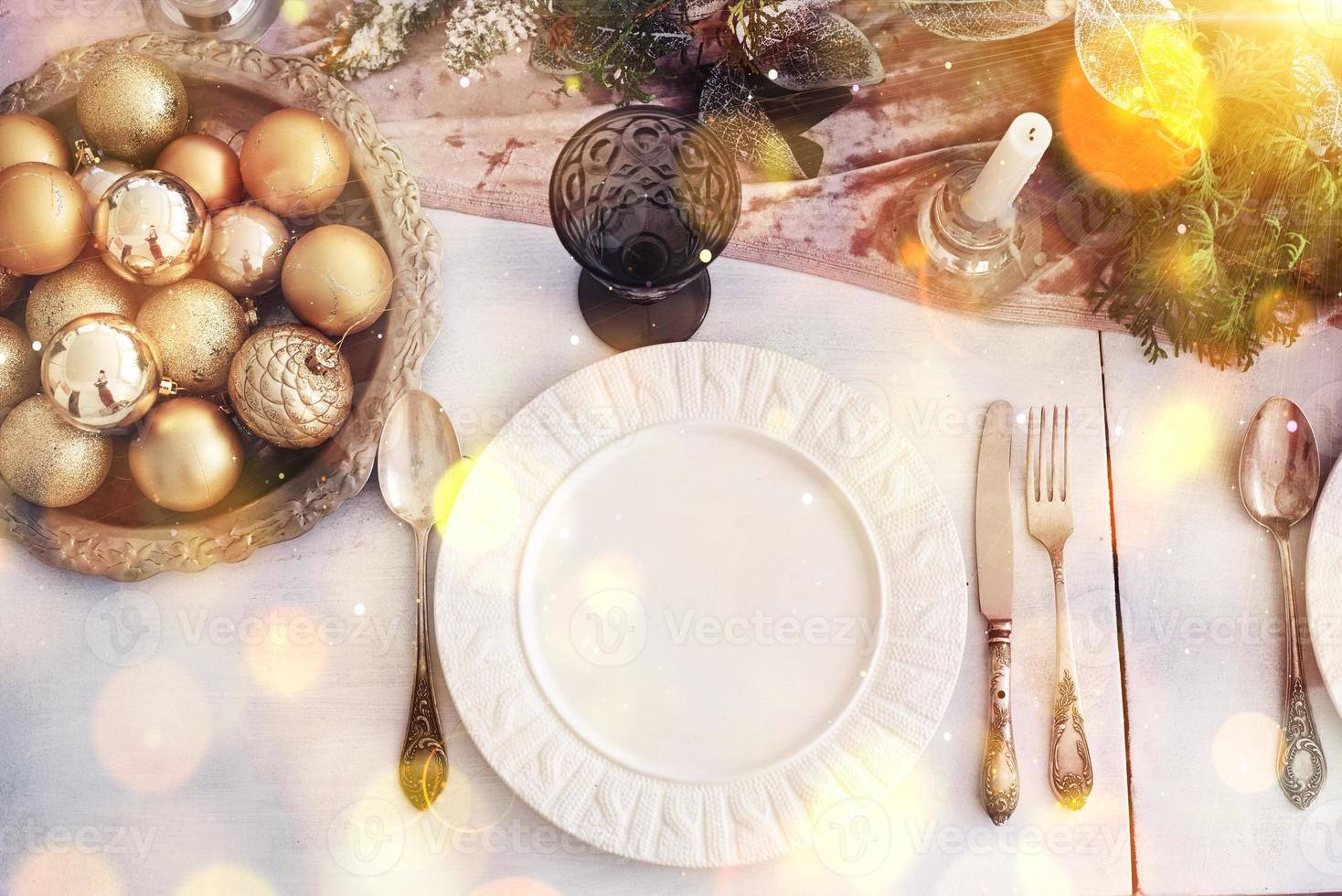 Table served for Christmas dinner in living room, top view. Bokeh light soft effect photo