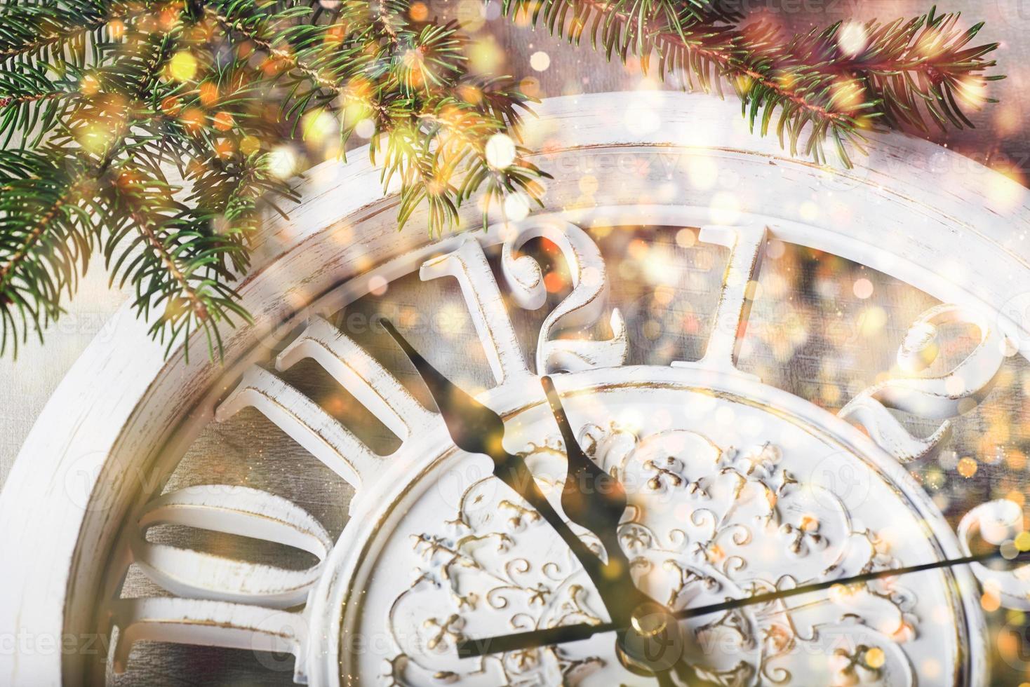 Happy New Year at midnight 2018, Old wooden clock and fir branches photo