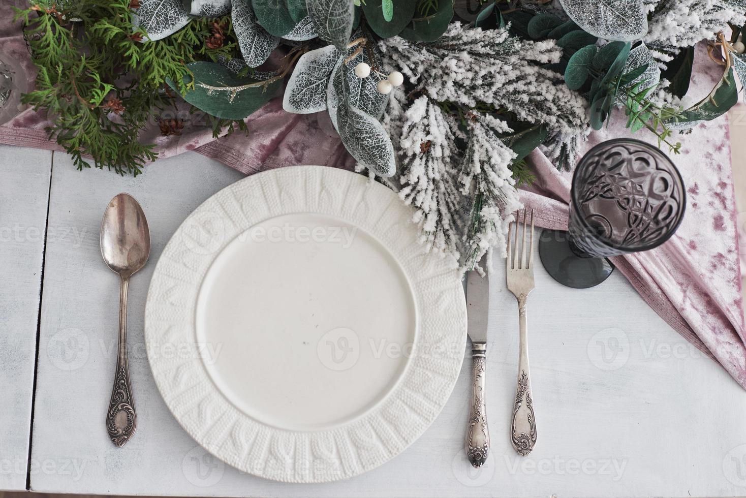 Table served for Christmas dinner in living room, top view 6407407