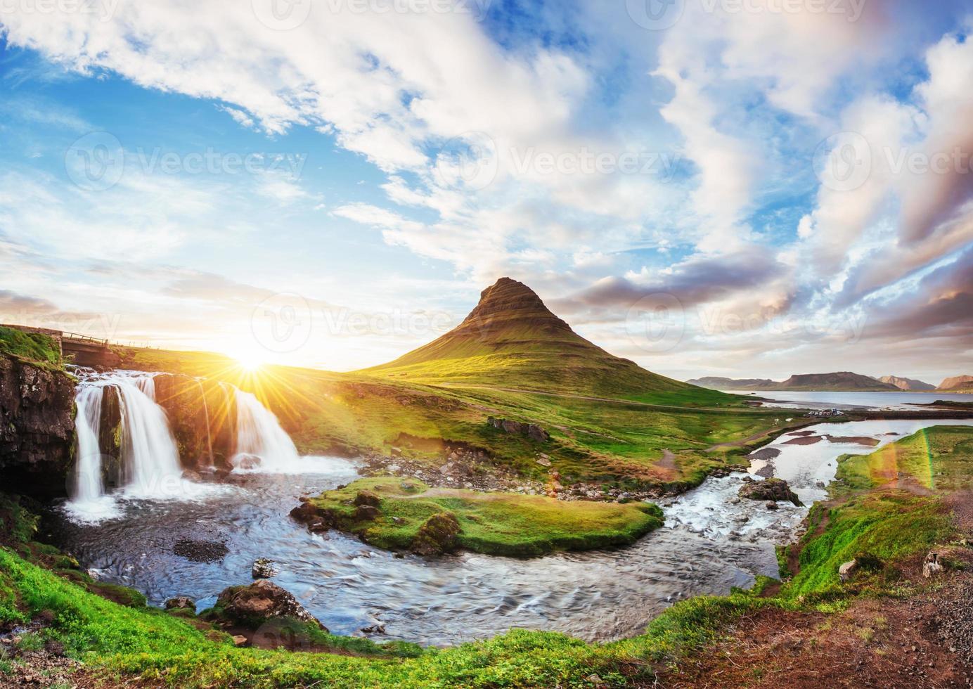 The picturesque sunset over landscapes and waterfalls. Kirkjufell mountain, Iceland photo