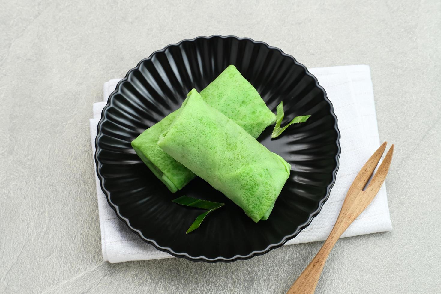 Sweet coconut pancake, Indonesian dessert made from flour with grated coconut mixed palm sugar. photo