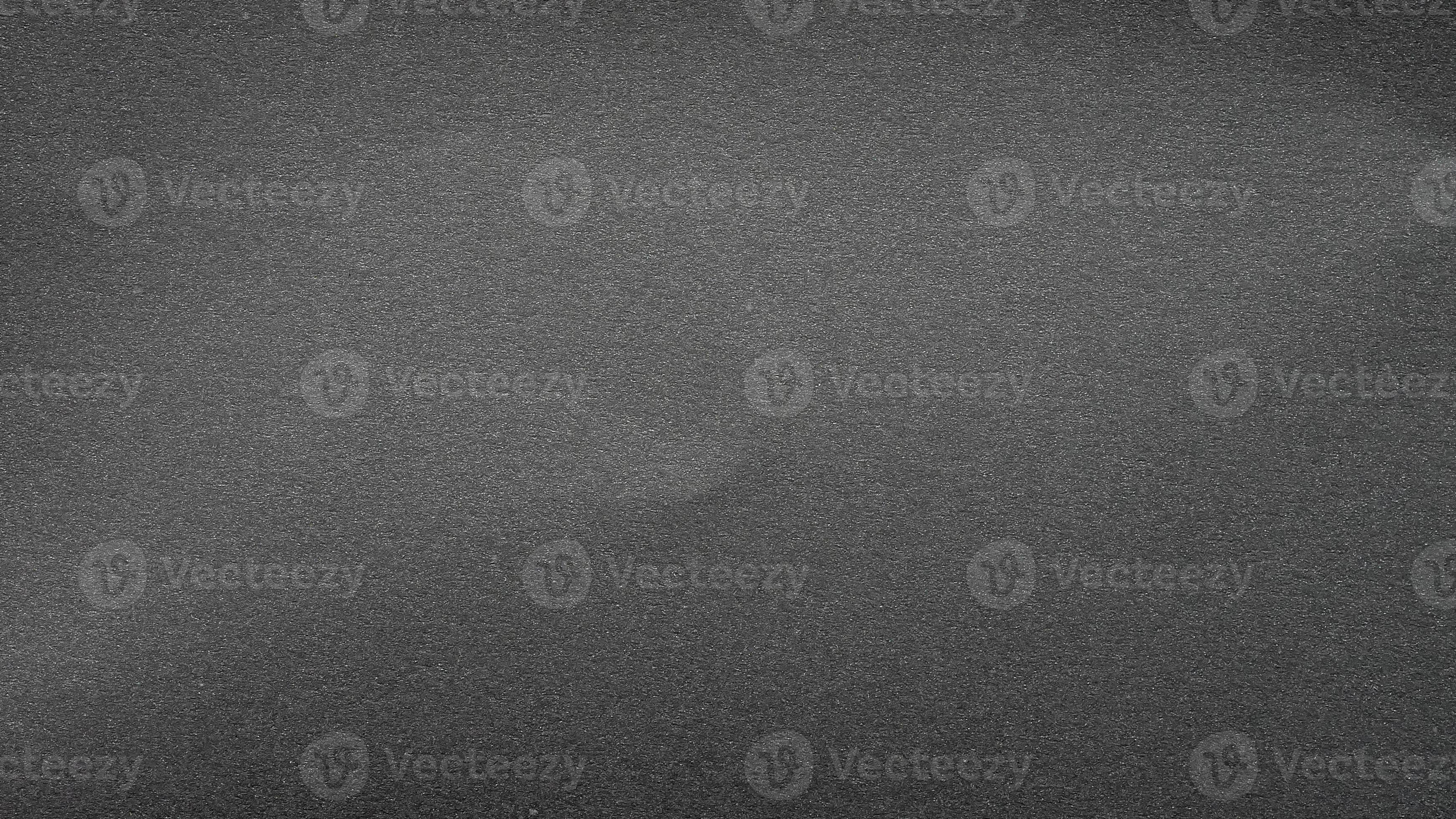 texture of black matte paper grainy gray effect canvas. seamless