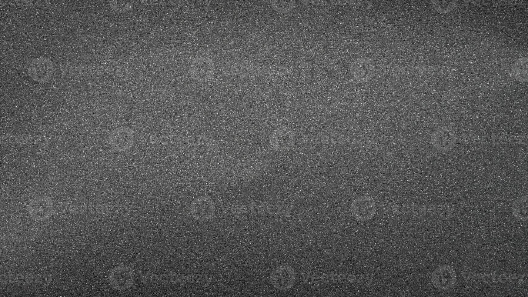 texture of black matte paper grainy gray effect canvas. seamless texture grainy noise effect on dark gray photo
