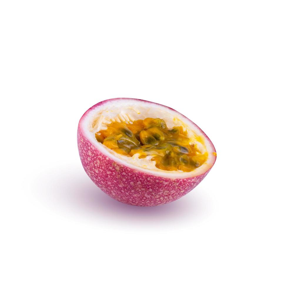 Whole passionfruit and a half of maracuya isolated on white background. photo