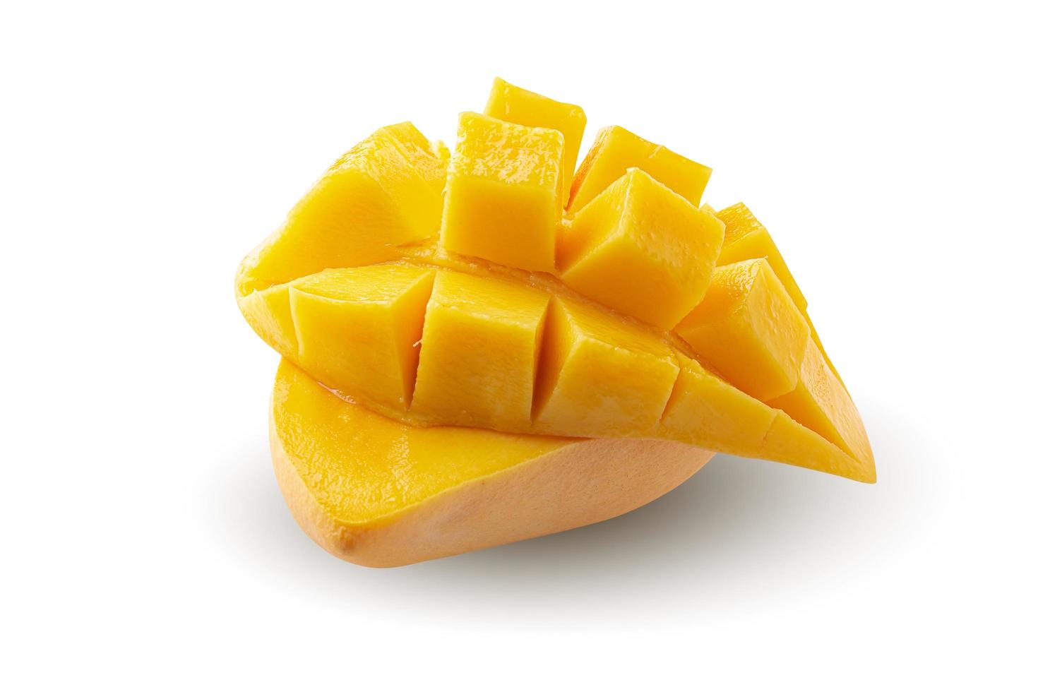 Mango fruit with mango cubes and slices Isolated on white background photo