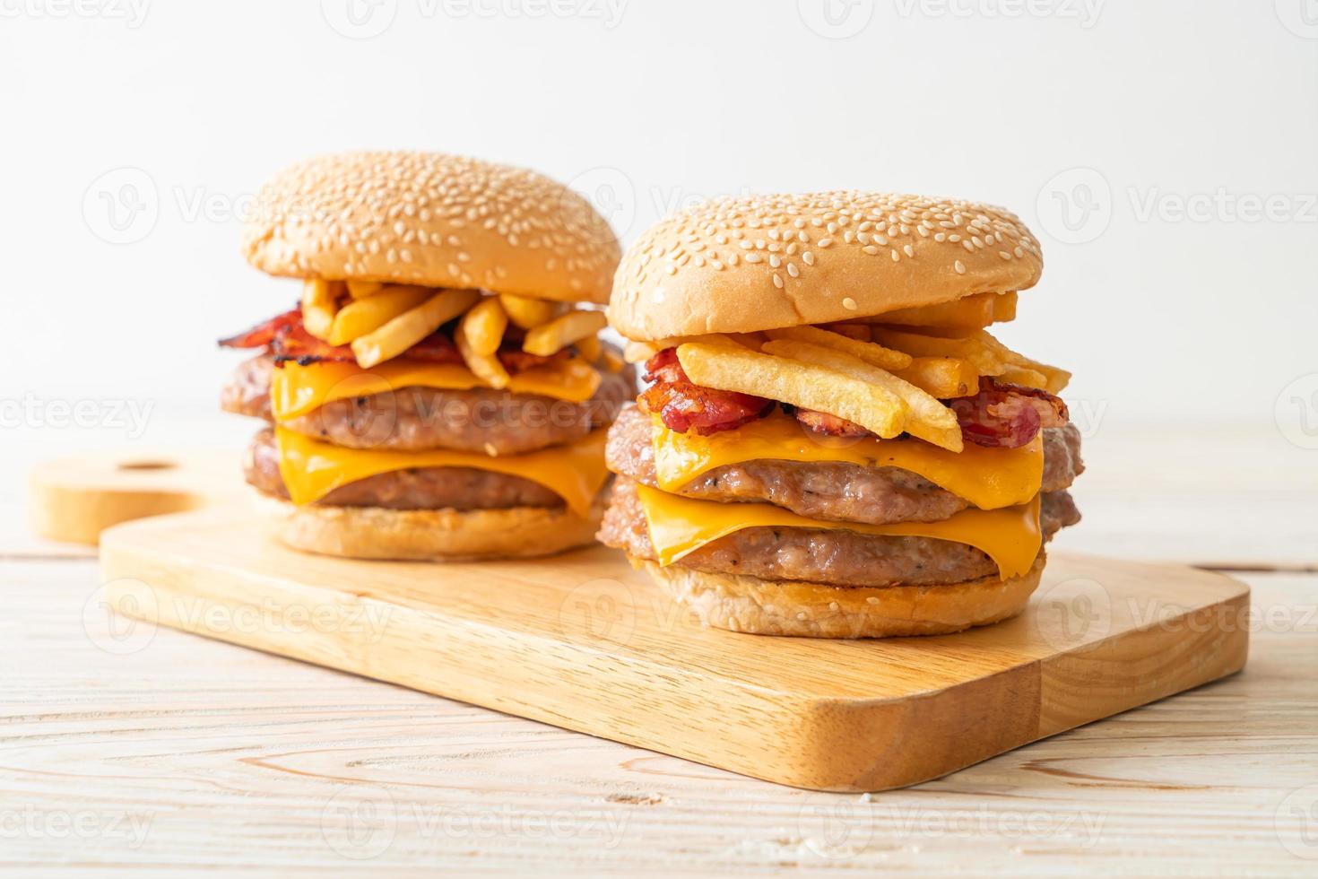 pork burger with cheese, bacon and french fries photo