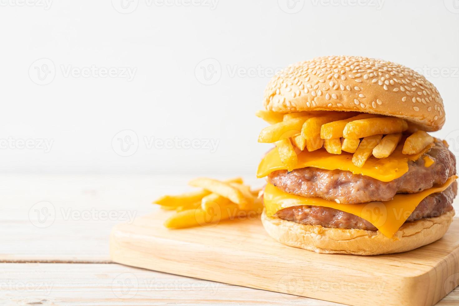 pork burger with cheese and french fries photo