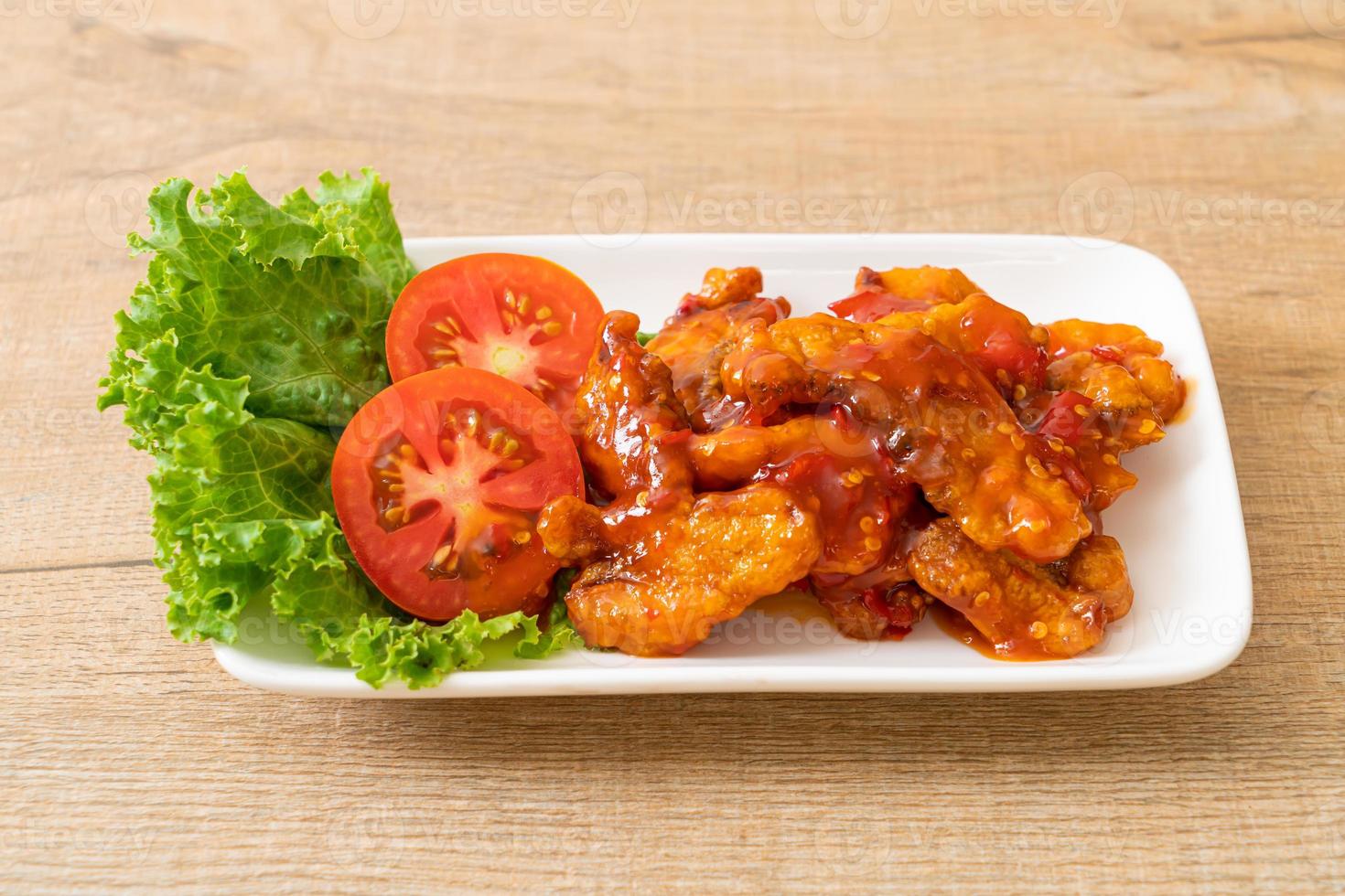 Fried fish topped with 3 flavors chili sauce photo